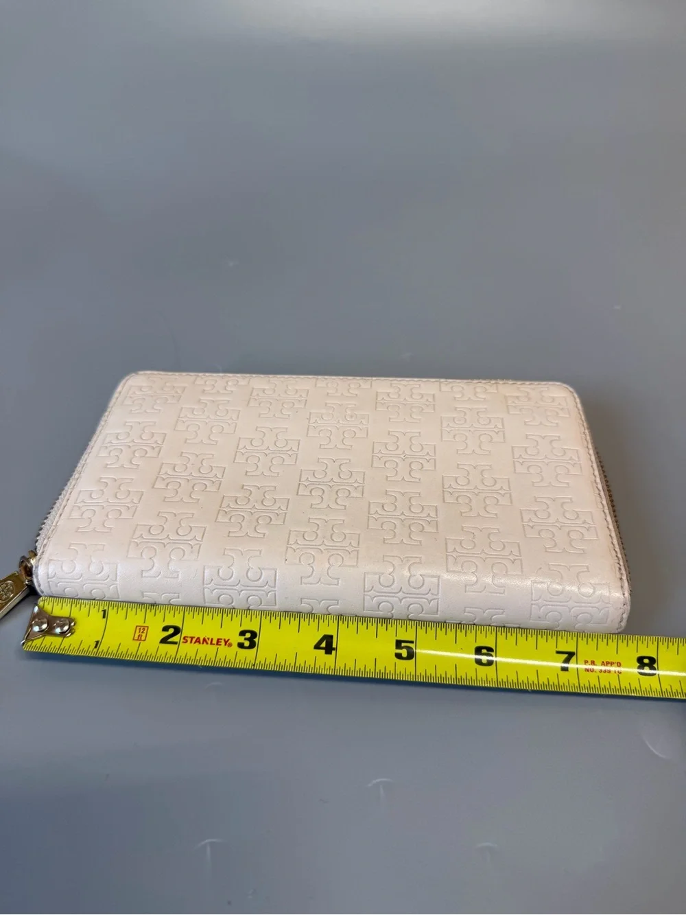 Tory Burch Leather Embossed Monogram zip wallet Off white